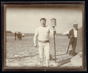 Fred Winters, Competitor in the Barbell Contest at the 1904 Olympics Posing with Weights